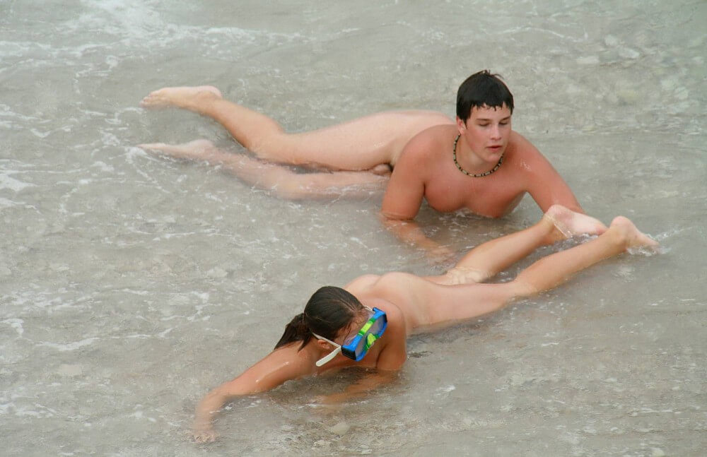 Wading In The Shallows pics - Clothing is a barrier for a nudist