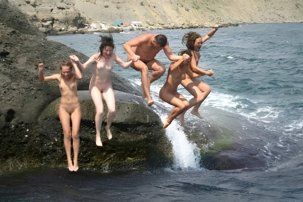 Mens and girls nudists on a beach - Naturism teaches us to accept ourselves and others without embarrassment